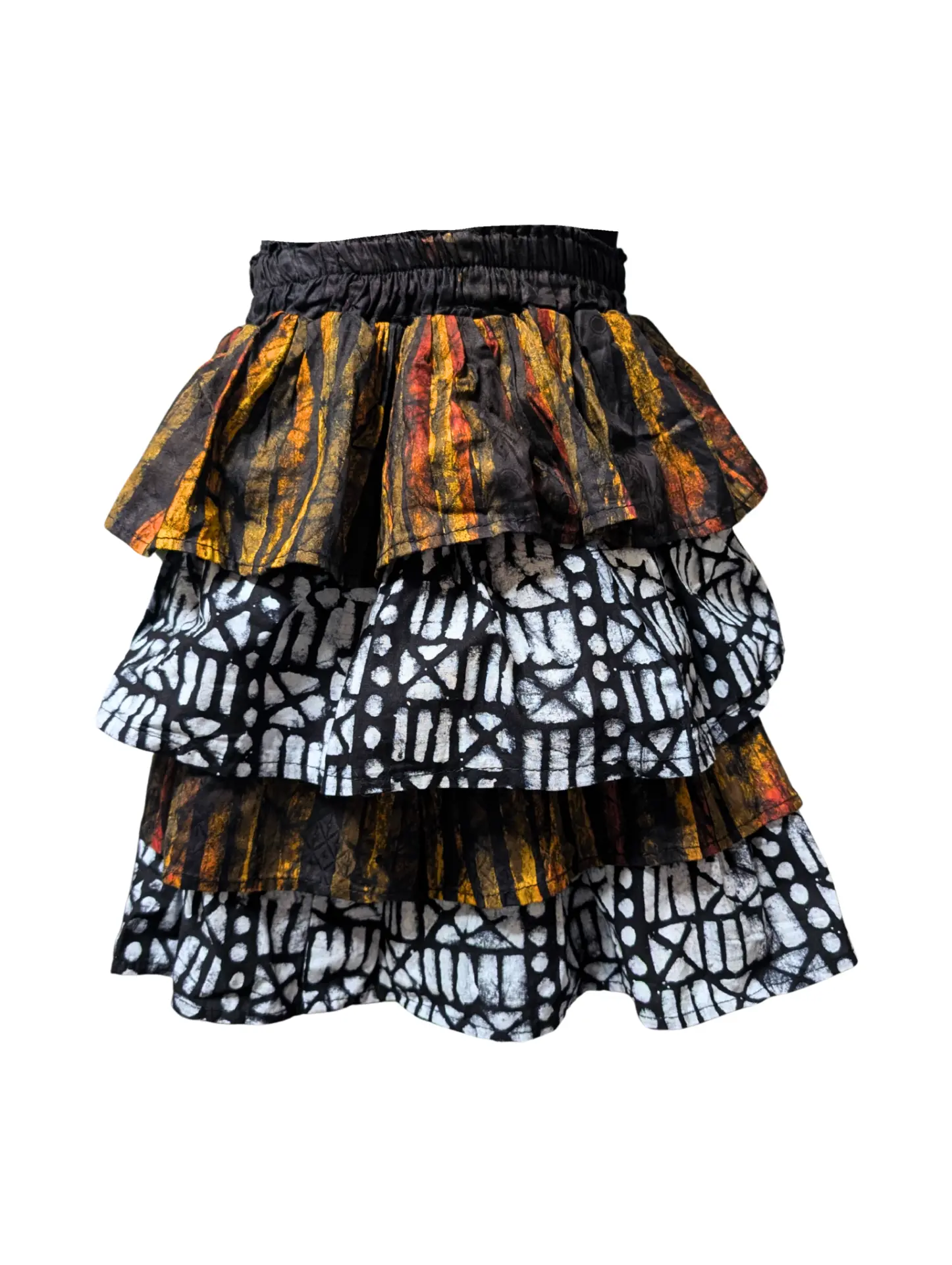 Tiered mini skirt made from recycled Nigerian batik cotton off-cuts in ochre and black-and-white prints